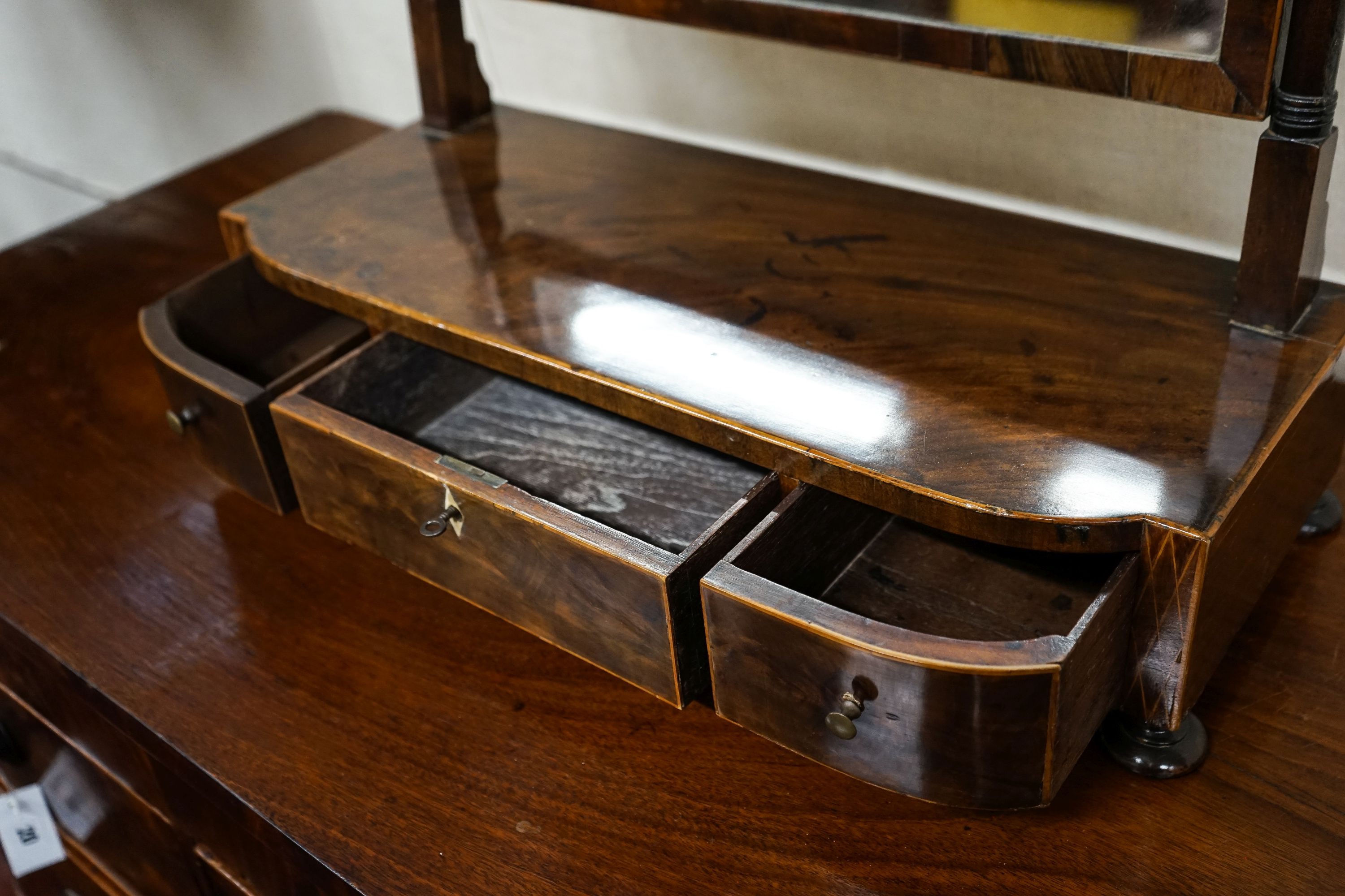 A George IV mahogany toilet mirror, with three drawer box base, width 58cm, depth 24cm, height 59cm